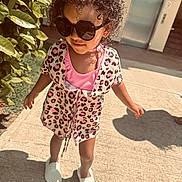 Riella is registered to the contest to win money with this photo: accessories, child, clothing, dress, face, female, footwear, girl, hair, head, person, photography, portrait, sandal, shoe, shorts, skirt, sleeve, sneaker, sunglasses