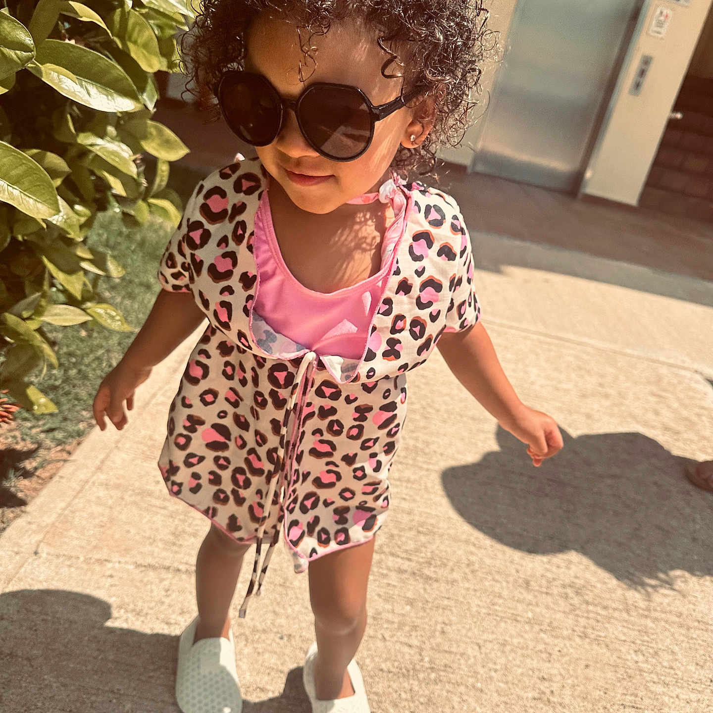 Riella is registered to the contest to win money with this photo: accessories, child, clothing, dress, face, female, footwear, girl, hair, head, person, photography, portrait, sandal, shoe, shorts, skirt, sleeve, sneaker, sunglasses