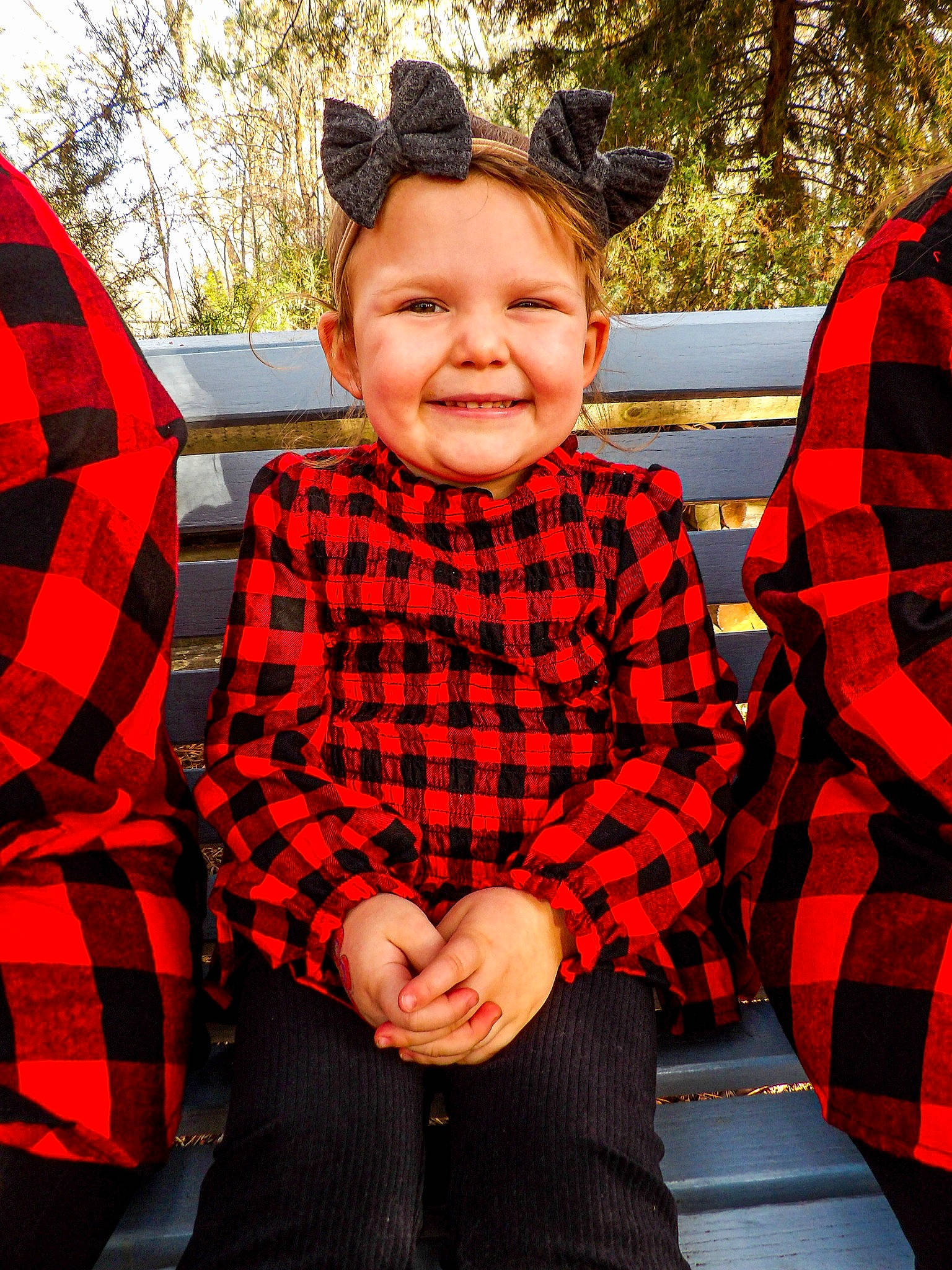 Kenleigh is registered to the contest to win money with this photo: black, child, event, face, facial_expression, fun, happy, human_body, joy, lap, leisure, pattern, person, plaid, red, sitting, sleeve, smile, standing, tartan