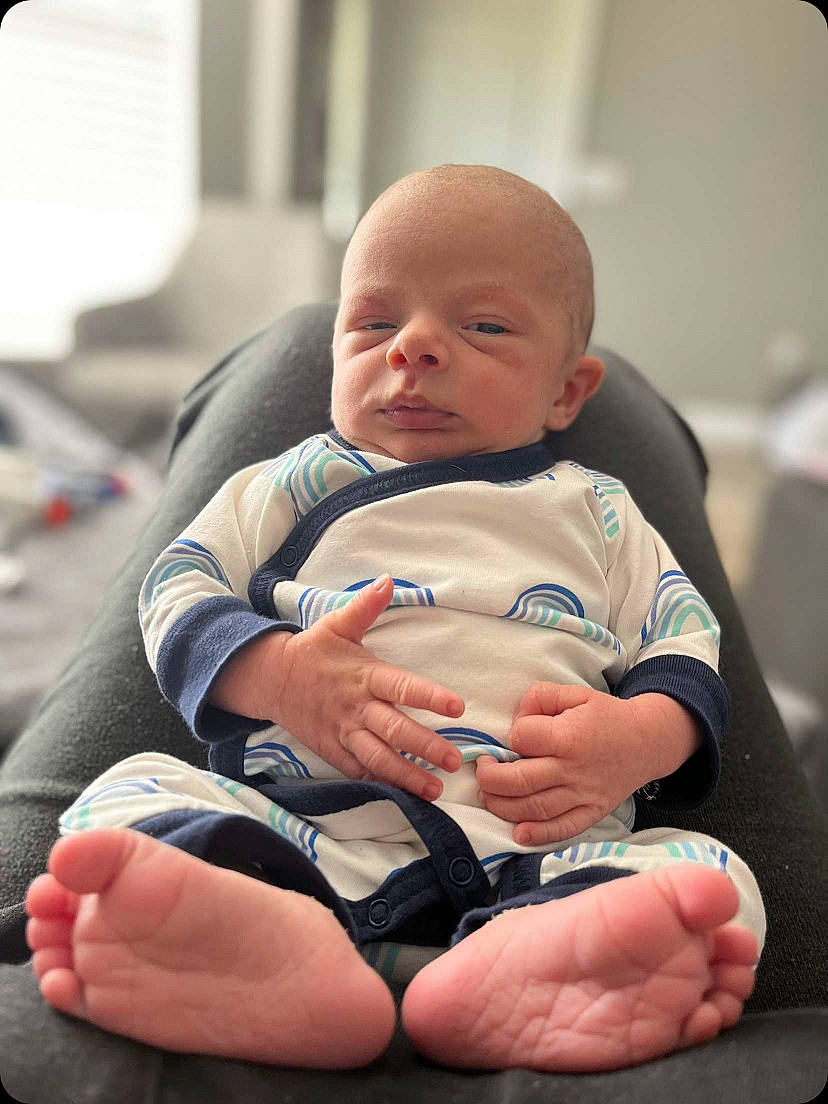 Henley joined the competition — help win amazing prizes! arm, baby, baby_toddler_clothing, cheek, child, comfort, elbow, finger, gesture, hand, health_care, human_leg, knee, lap, leg, mouth, person, skin, thigh, thumb