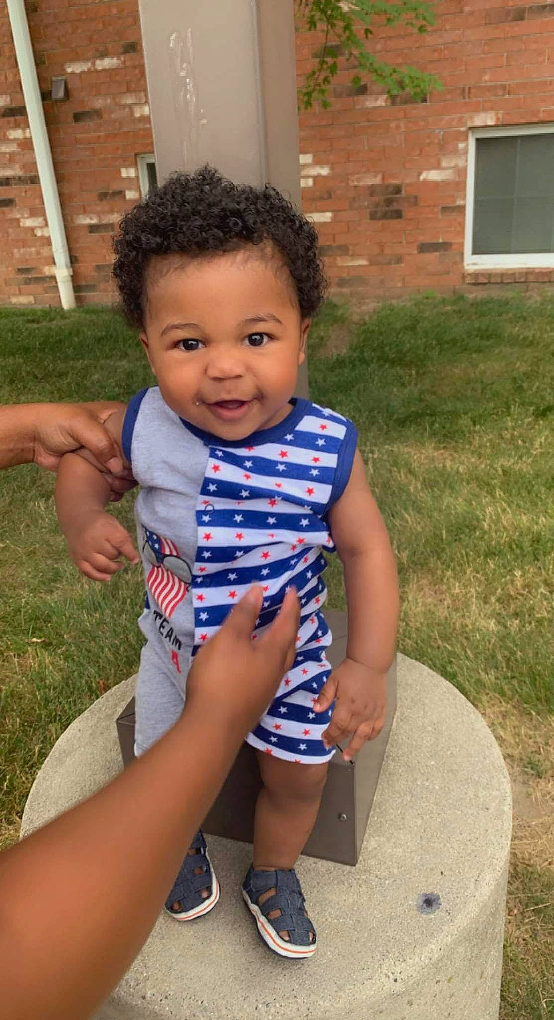 Ty'Destined joined the competition — help win amazing prizes! baby, baby_toddler_clothing, child, electric_blue, eye, face, facial_expression, fun, grass, happy, head, human_leg, leg, leisure, person, sitting, skin, thigh, thumb, toddler