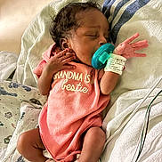 Journey joined the competition — help win amazing prizes! baby, blanket, child, closeup, cute, hospital, hospital_bed, indoors, infant, medical_wires, newborn, pacifier, peaceful, person, pink_onesie, resting, sleeping, soft_lighting, wearing_clothes, wristband