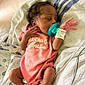 baby, blanket, child, closeup, cute, hospital, hospital_bed, indoors, infant, medical_wires, newborn, pacifier, peaceful, person, pink_onesie, resting, sleeping, soft_lighting, wearing_clothes, wristband