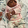 Journey is registered to the contest to win money with this photo: baby, bed, blanket, child, clothing, comfort, cute, hand, hat, hospital, indoors, infant, lying, medical, newborn, pastel, person, sleepy, soft, toddler