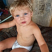 Jaxx is registered to the contest to win money with this photo: child, toddler, diaper, blue_eyes, blonde_hair, dirty_face, sitting, indoor, woven_chair, wooden_floor, curious, messy, bare_chest, home_environment, playful, young, person, portrait, casual, adventure