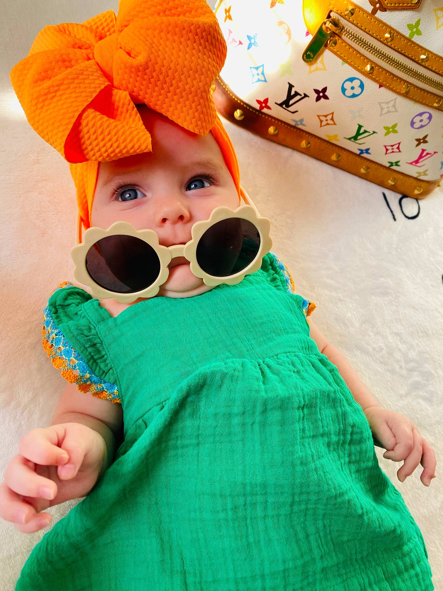 Emersyn joined the competition — help win amazing prizes! baby, baby_toddler_clothing, cap, child, eyewear, face, facial_expression, fun, goggles, happy, hat, headgear, headwear, orange, pattern, person, pink, skin, sleeve, sunglasses