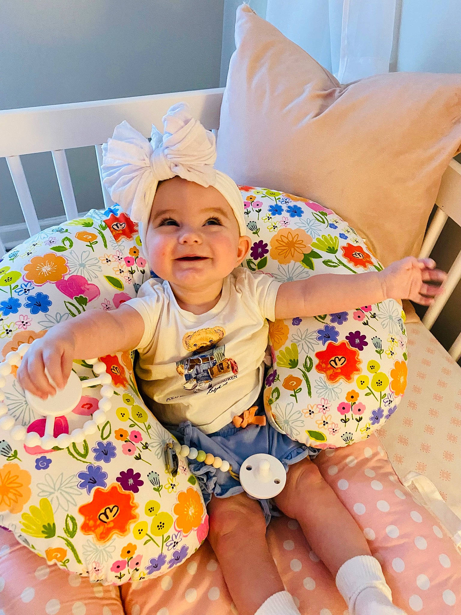 Emersyn joined the competition — help win amazing prizes! baby, baby_toddler_clothing, child, comfort, couch, fun, happy, hat, headwear, human_leg, linens, pattern, person, pillow, pink, purple, room, shorts, smile, t_shirt