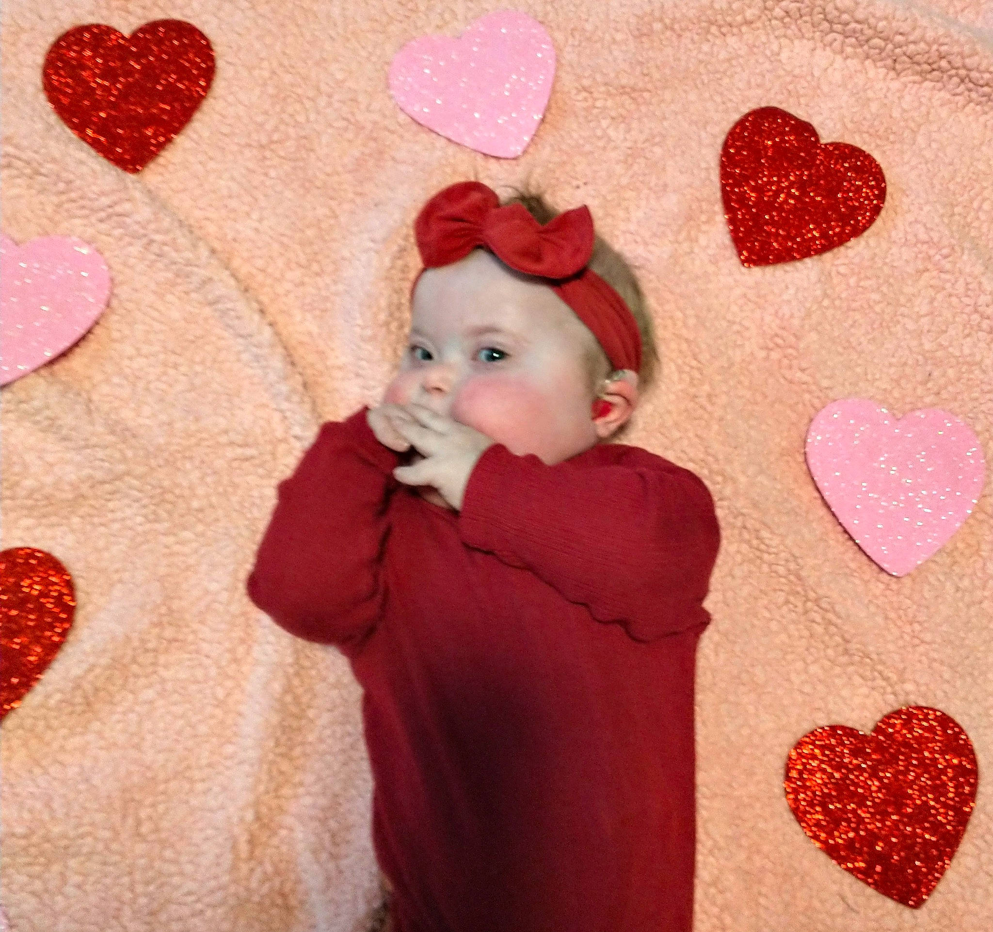 Evie joined the competition — help win amazing prizes! baby, baby_toddler_clothing, carmine, child, costume_hat, event, happy, headwear, holiday, linens, magenta, organ, pattern, peach, person, pink, product, red, room, sleeve