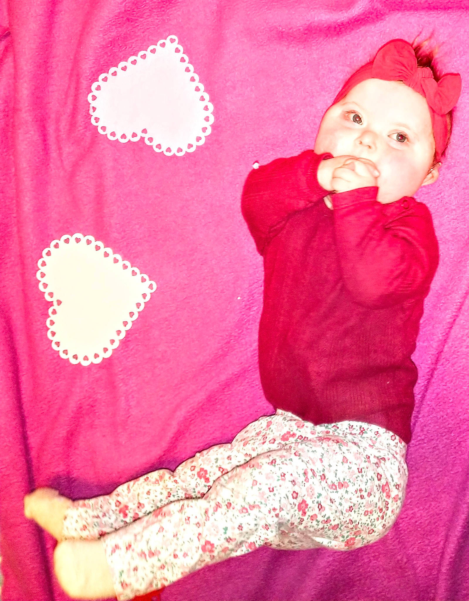 Evie joined the competition — help win amazing prizes! baby, baby_toddler_clothing, comfort, hand, happy, hat, headwear, human_leg, linens, magenta, organ, outerwear, pattern, person, pink, red, sleeve, t_shirt, textile, thigh