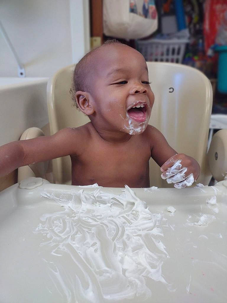 King is registered to the contest to win money with this photo: baby, baby_products, baby_toddler_clothing, bathing, cheek, chest, child, event, eye, eyebrow, flooring, fun, happy, iris, mouth, person, room, skin, smile, table