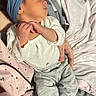 Leilani is registered to the contest to win money with this photo: baby, newborn, sleeping, headband, infant, clothing, hand, tattoo, blanket, fabric, person, skin, cute, cozy, rest, peaceful, sleep, soft, bed, comfort