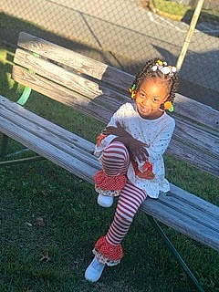 Jaysonnah is registered to the contest to win money with this photo: baby, baby_toddler_clothing, child, face, fun, grass, happy, head, joy, lawn, leg, leisure, outdoor_furniture, person, plant, recreation, sandal, sitting, sock, sunglasses