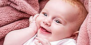 Isabella is registered to the contest to win money with this photo: baby, smiling, infant, blanket, pink, soft, cute, hand, face, closeup, happy, skin, child, portrait, expression, newborn, warm, comfort, cuddle, joy