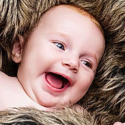 Isabella joined the competition — help win amazing prizes! baby, smiling, happy, face, portrait, child, infant, fur, blanket, skin, closeup, cute, young, expression, mouth, cheeks, eyes, head, furry, soft
