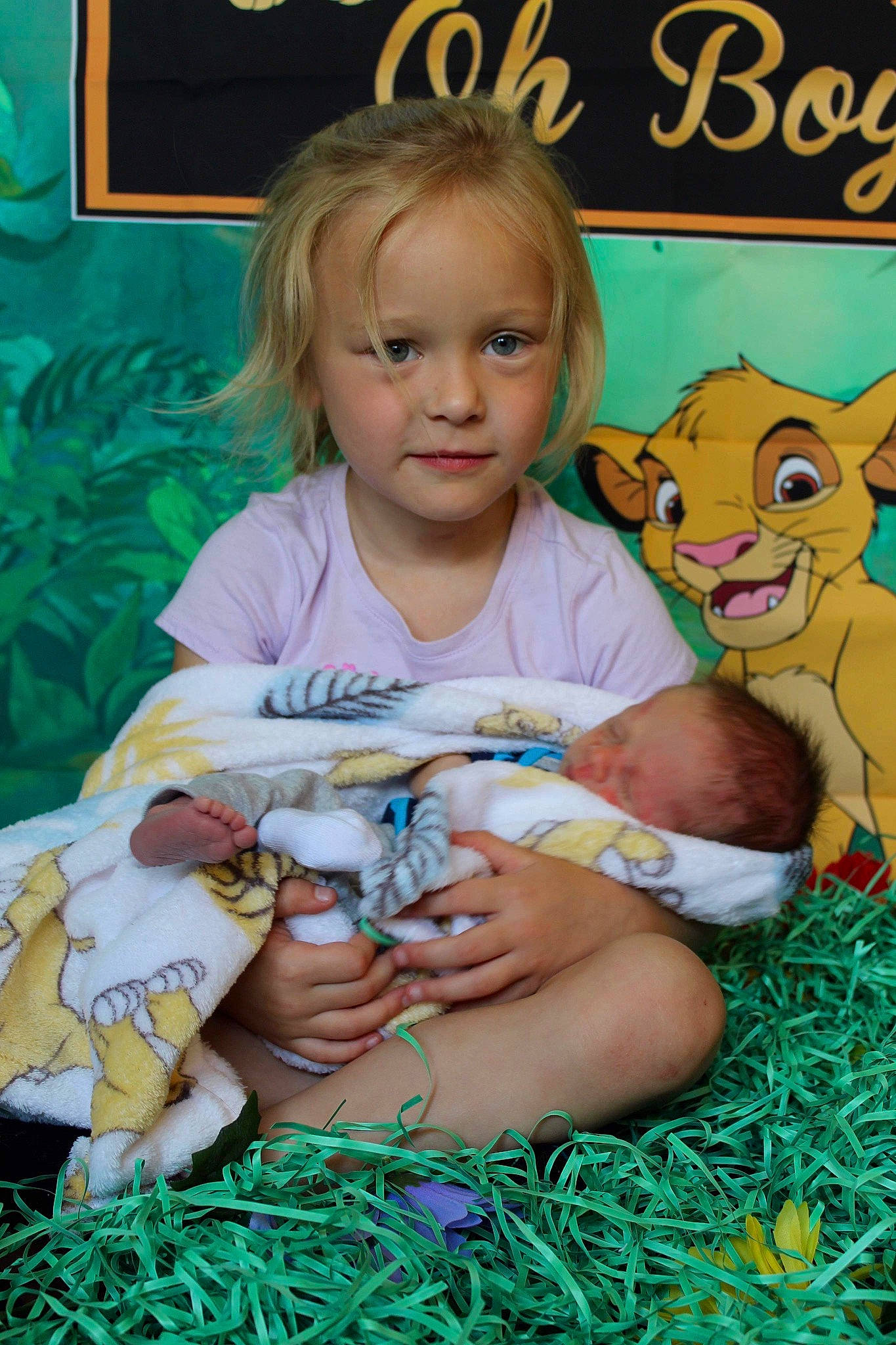 Aliya is registered to the contest to win money with this photo: baby, baby_toddler_clothing, child, finger, fun, grass, happy, lap, leisure, linens, mammal, organ, person, picture_frame, play, product, sitting, skin, t_shirt, toddler