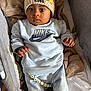 baby, beads, beanie, blanket, child, clothing, cozy, cute, face, hands, hat, indoors, infant, lion_king, nike, personalized, portrait, seat, sitting, young