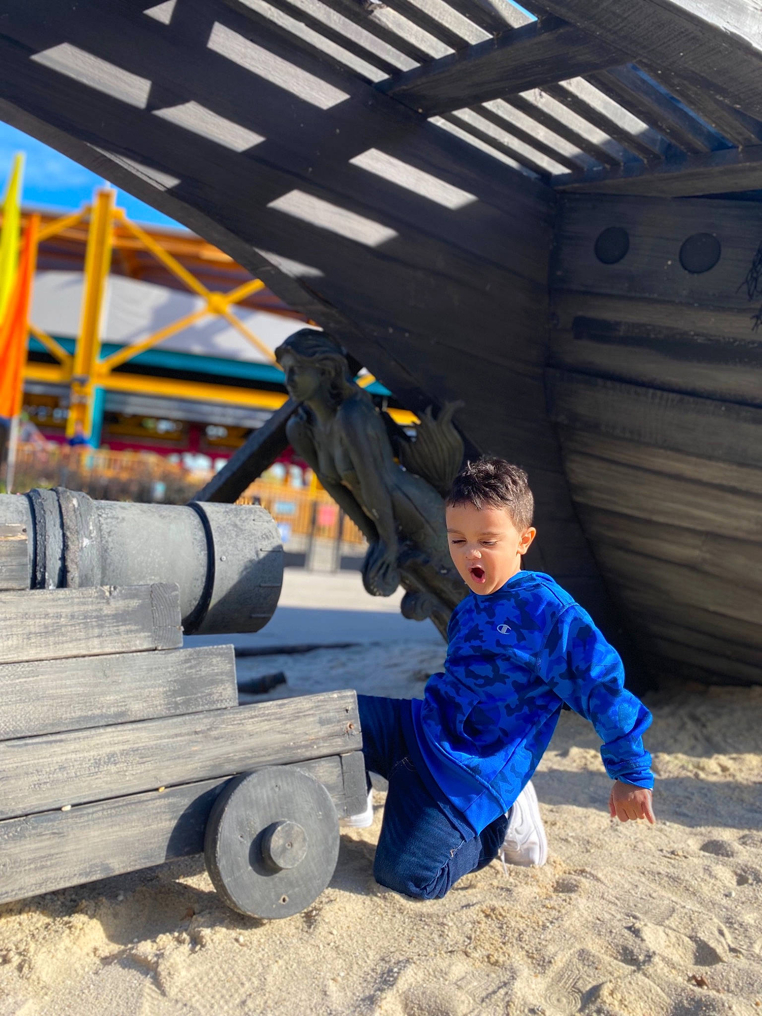Caden is registered to the contest to win money with this photo: auto_part, automotive_tire, automotive_wheel_system, electric_blue, fun, helmet, jacket, leisure, person, personal_protective_equipment, recreation, rolling, sitting, sneakers, soil, tire, toddler, travel, tree, wheel