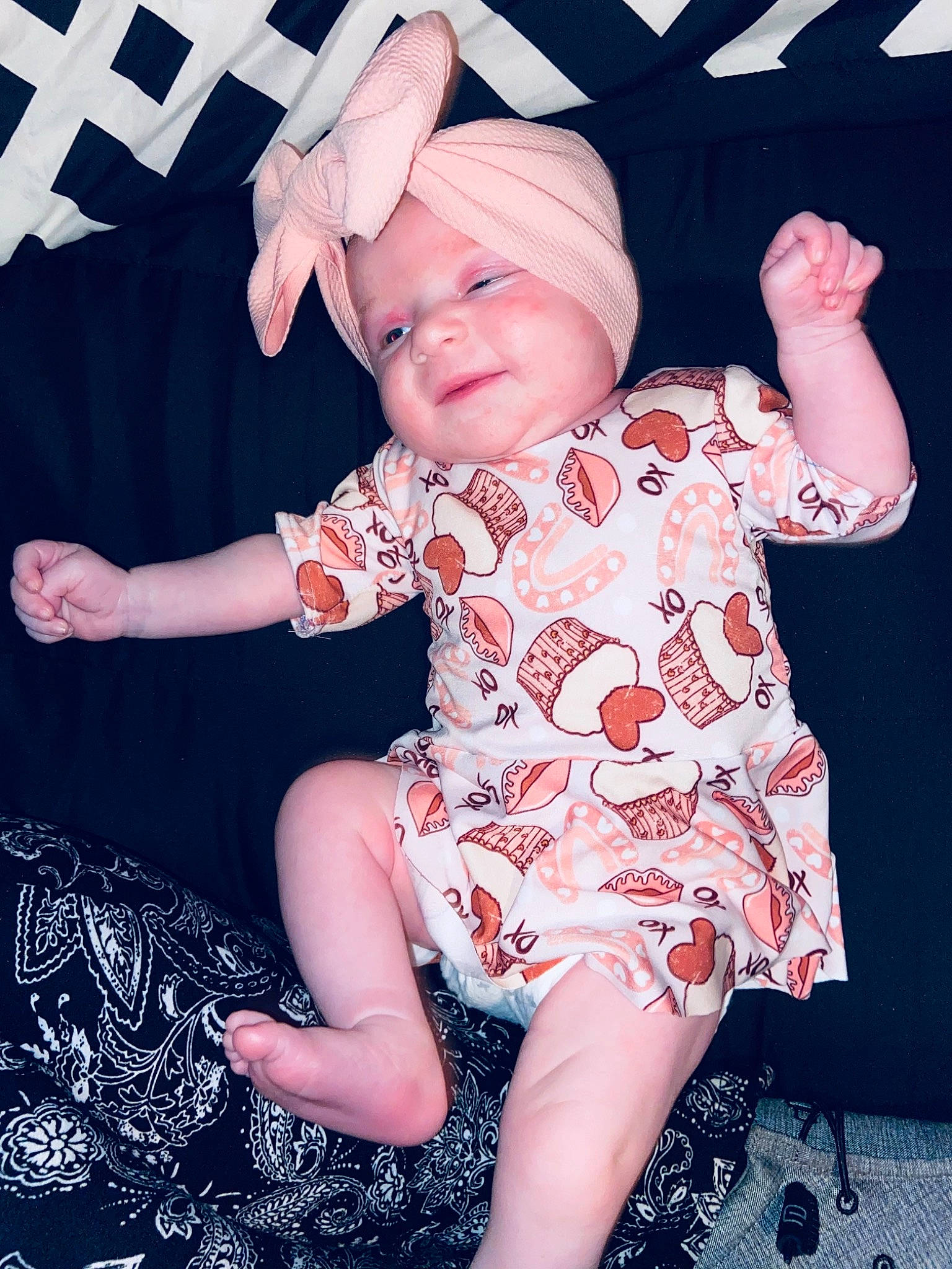 Faelynn is registered to the contest to win money with this photo: arm, baby, baby_toddler_clothing, cool, face, finger, hand, happy, head, headgear, headwear, human, human_body, leg, person, pink, purple, skin, sleeve, smile