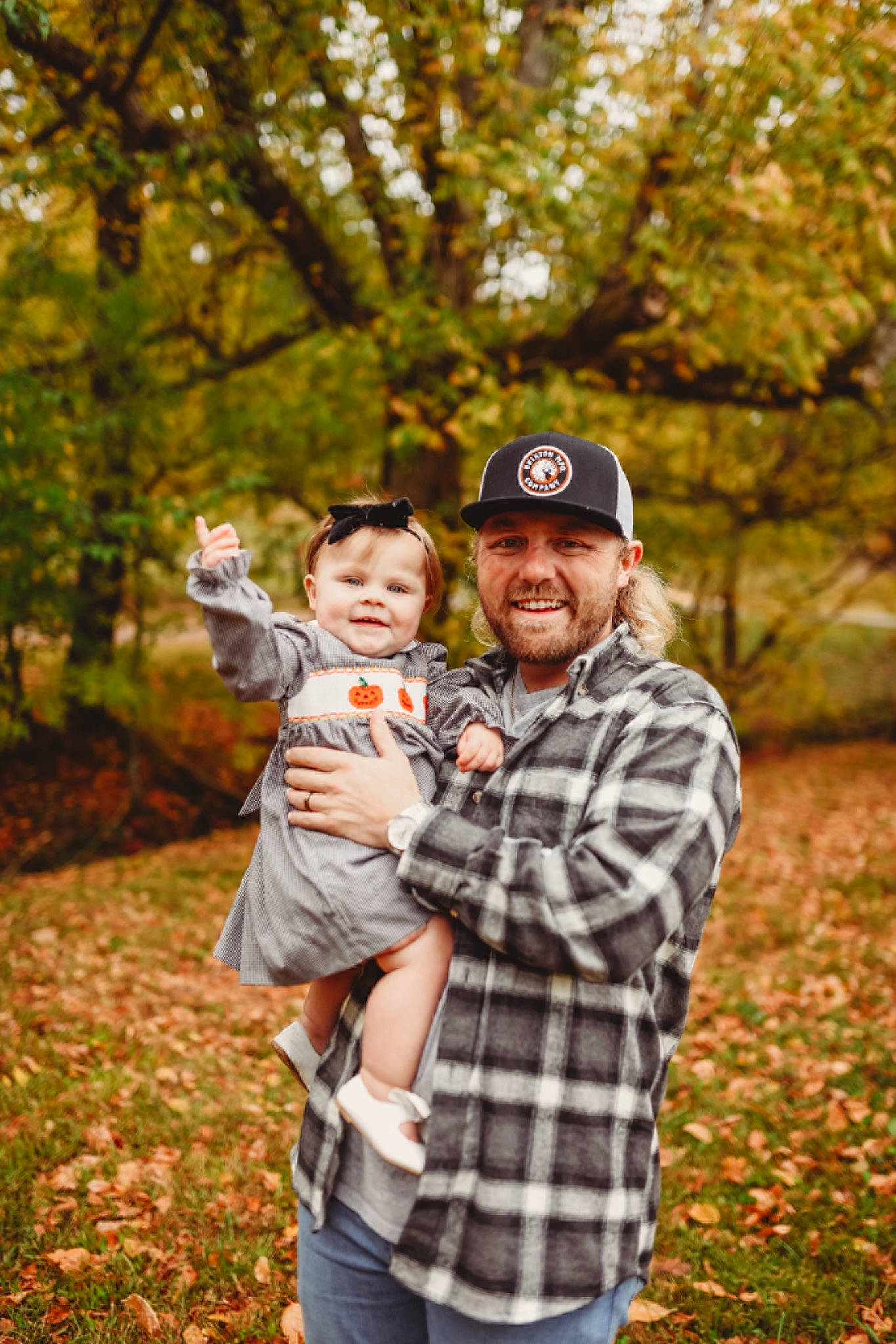 Remington joined the competition — help win amazing prizes! cap, clothing, deciduous, forest, fun, gesture, grass, happy, hat, headwear, joy, leaf, leisure, natural_landscape, people_in_nature, person, plaid, plant, recreation, smile