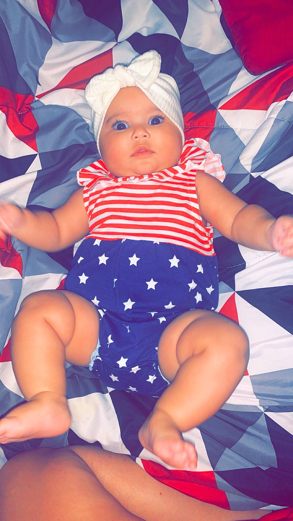 Blakelynn is registered to the contest to win money with this photo: baby, baby_sleeping, baby_toddler_clothing, comfort, electric_blue, finger, headwear, human_leg, knee, lap, leg, mouth, organ, pattern, person, pink, red, shorts, textile, thigh