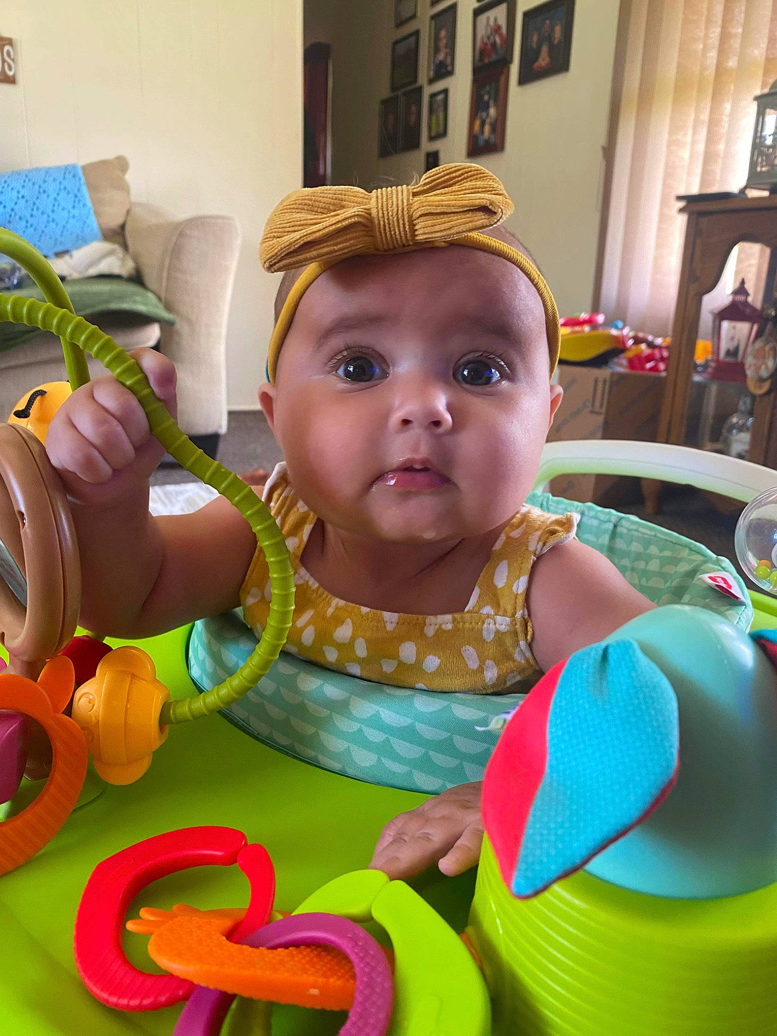 Blakelynn is registered to the contest to win money with this photo: baby, baby_products, baby_toddler_clothing, baby_toys, chair, child, curtain, event, facial_expression, fun, happy, leisure, person, picture_frame, plant, plastic, play, room, sitting, toddler