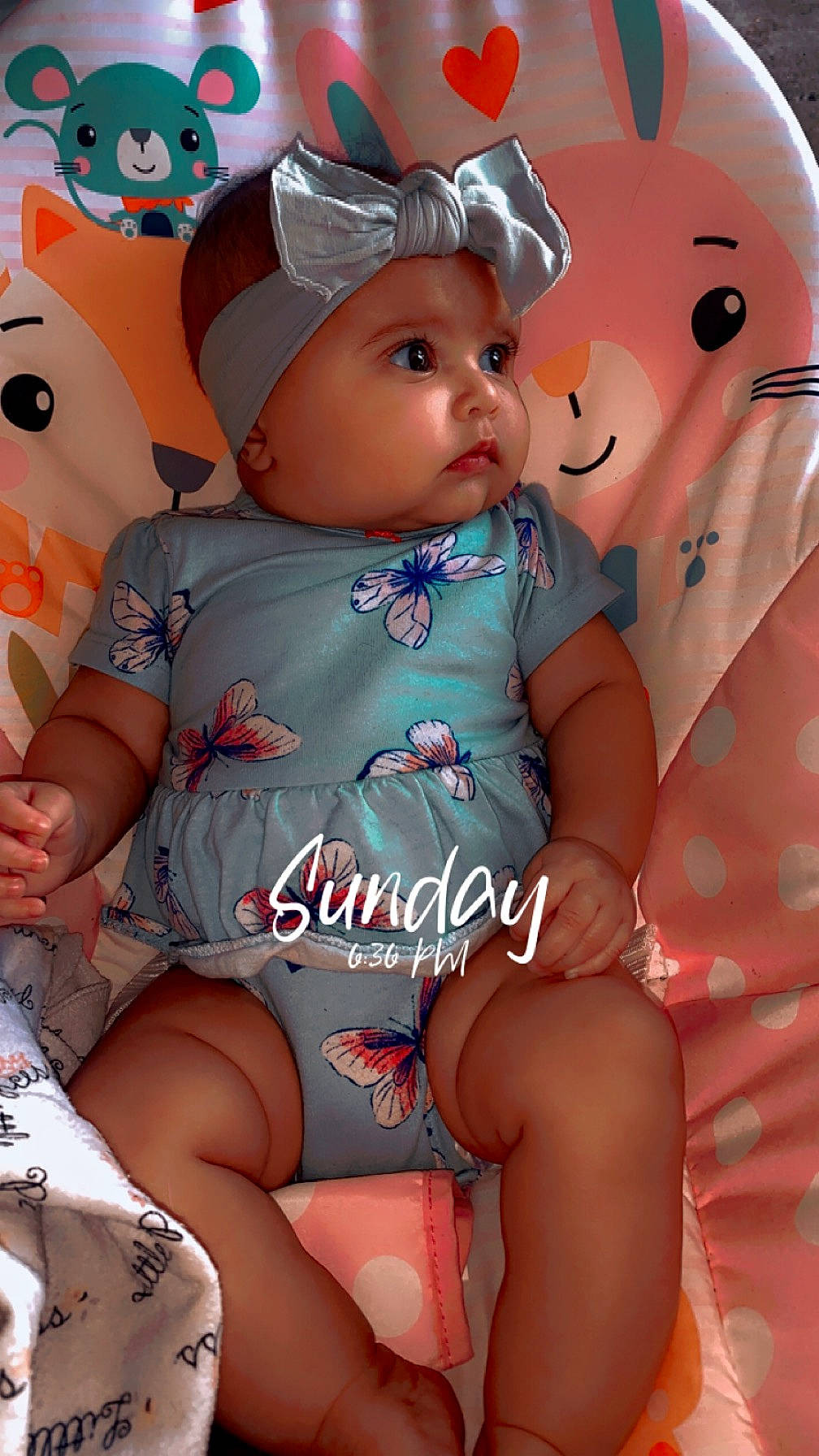 Blakelynn joined the competition — help win amazing prizes! baby, baby_toddler_clothing, cheek, child, face, facial_expression, fun, happy, hat, head, headwear, human_leg, lap, pattern, peach, person, pink, sitting, skin, textile