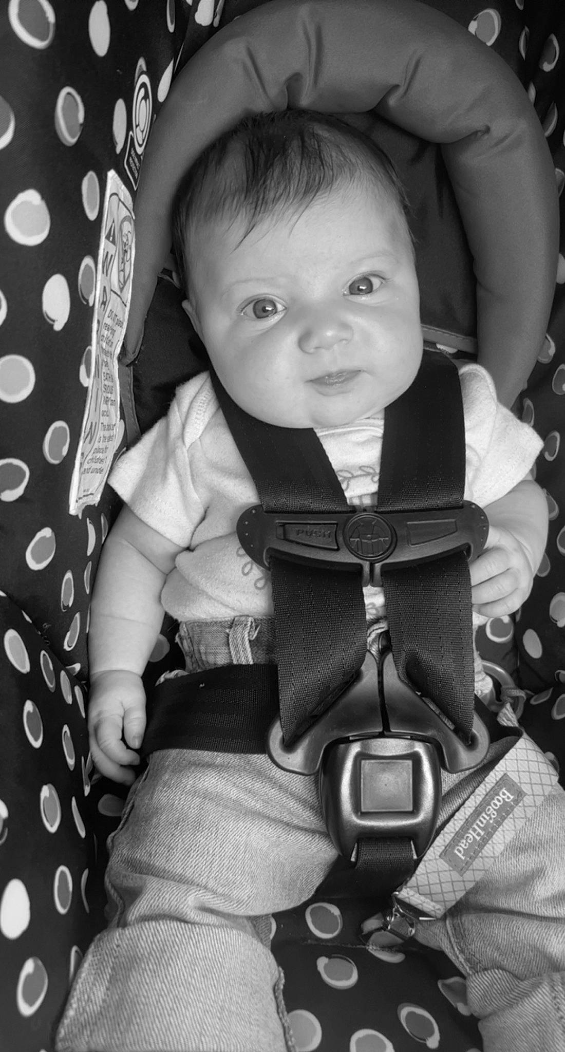 Oaklynn is registered to the contest to win money with this photo: arm, baby_toddler_clothing, black, cheek, facial_expression, flash_photography, hair, hairstyle, hand, head, human_body, organ, outerwear, person, photograph, product, skin, sleeve, smile, standing