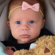 Elena joined the competition — help win amazing prizes! baby, infant, child, headband, pink_bow, blue_eyes, pacifier, stuffed_animal, teddy_bear, blanket, car_seat, portrait, closeup, lips, cheeks, hair, clothing, adorable, gaze, eyebrows