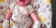 Kai joined the competition — help win amazing prizes! baby, baby_chair, baby_garment, child, clothing, comfort, cute, elephant_pattern, fabric, happy, indoor, infant, joy, mittens, pattern, person, playful, seat, smiling, striped_socks