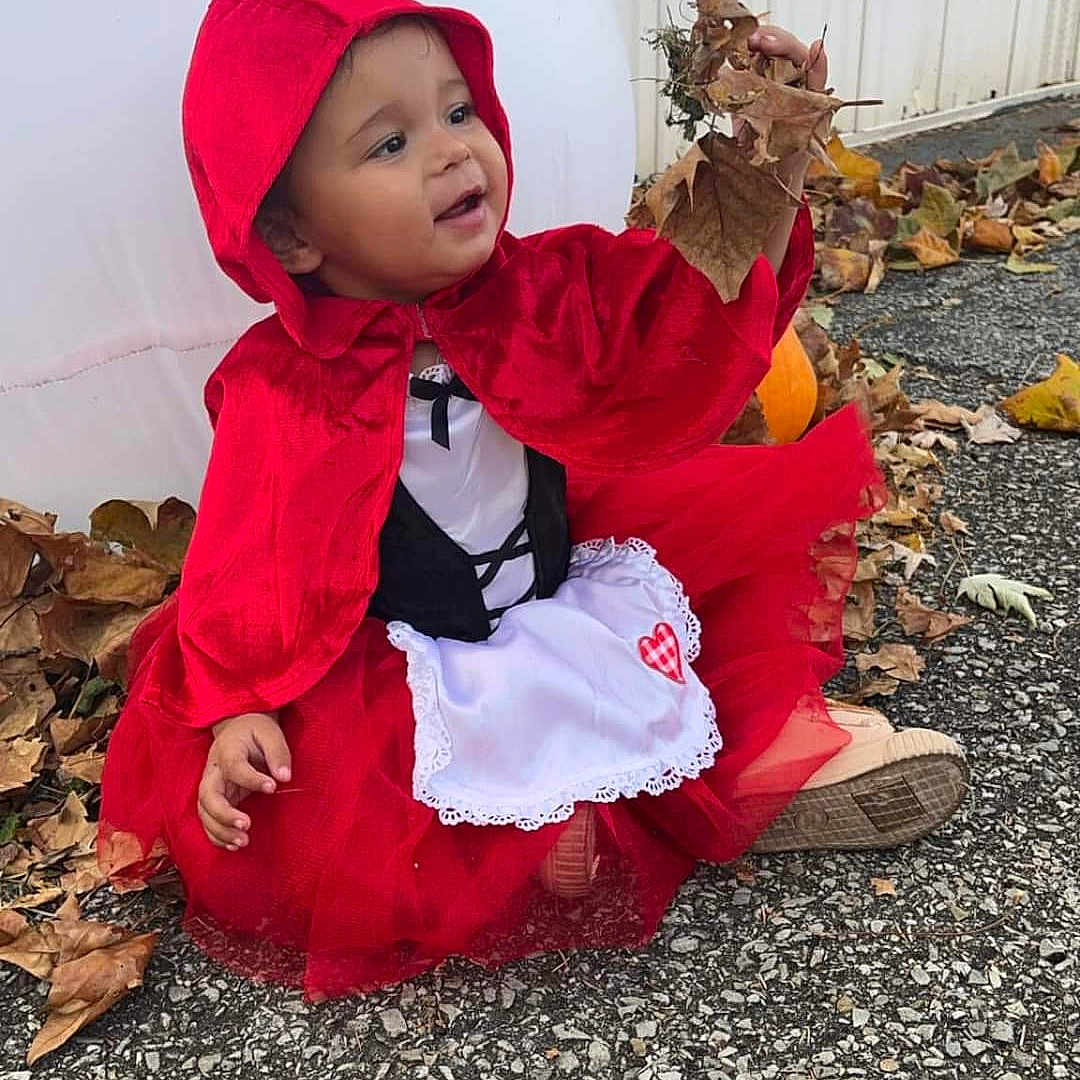 Acelyn is registered to the contest to win money with this photo: animal, baby, clothing, coat, dress, face, flower, food, head, hood, invertebrate, jacket, leaf, lobster, person, petal, photography, plant, portrait, sitting