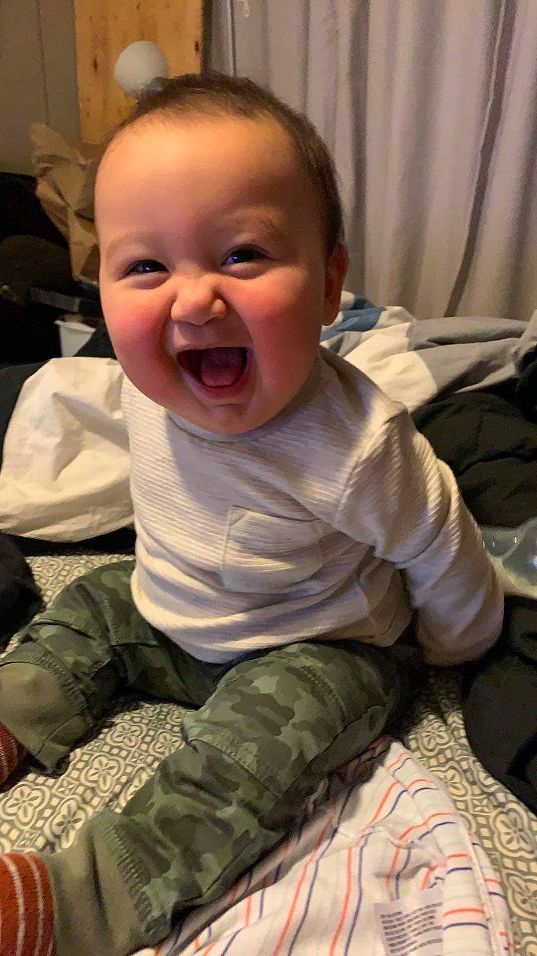 Nicolas joined the competition — help win amazing prizes! baby, baby_laughing, cheek, child, chin, face, facial_expression, head, laugh, mouth, nose, person, sitting, skin, smile, toddler, tongue, yawn
