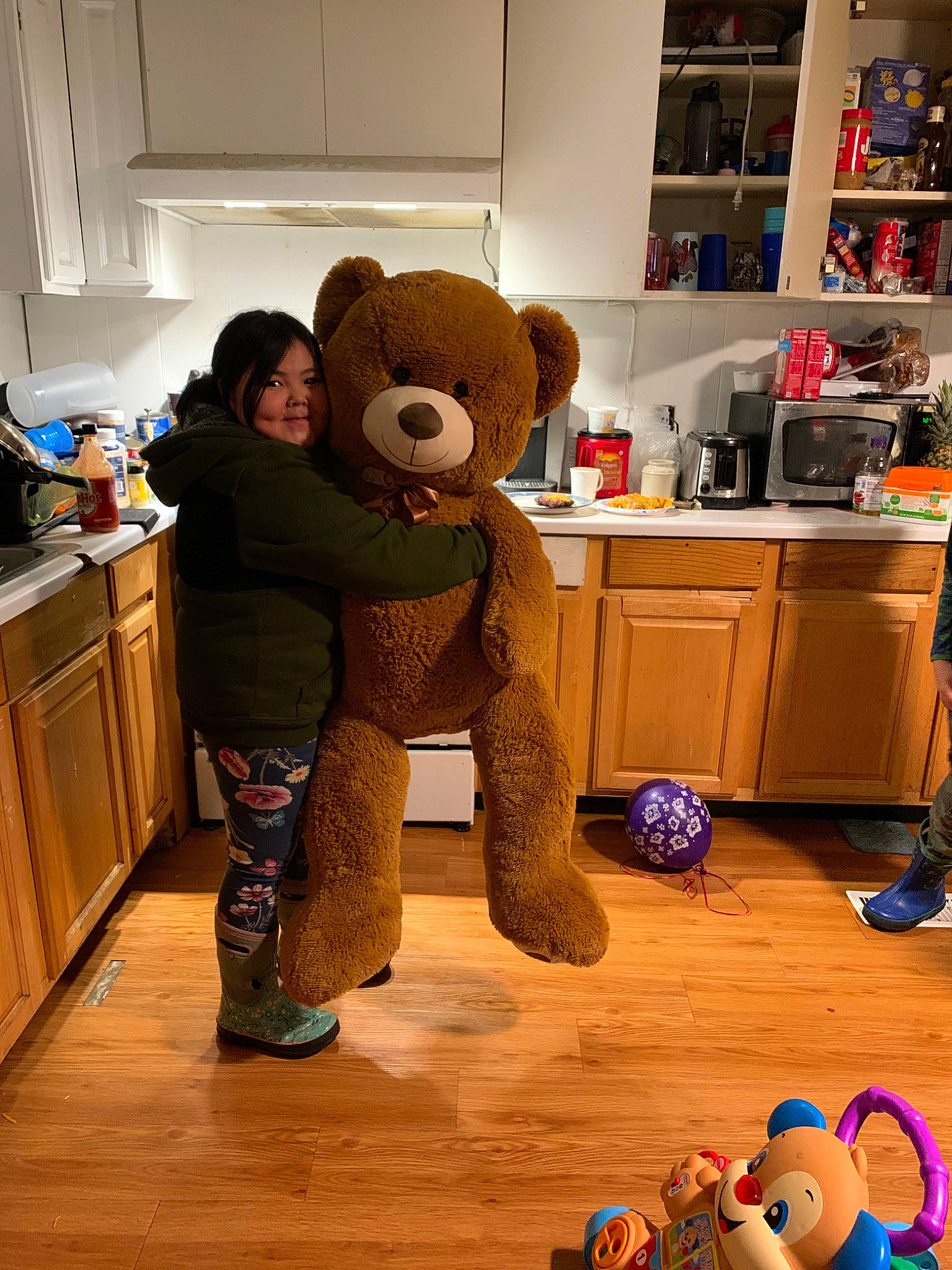 Nicolas is registered to the contest to win money with this photo: child, floor, flooring, fun, joy, mascot, person, plush, room, stuffed_toy, teddy_bear, toddler, toy