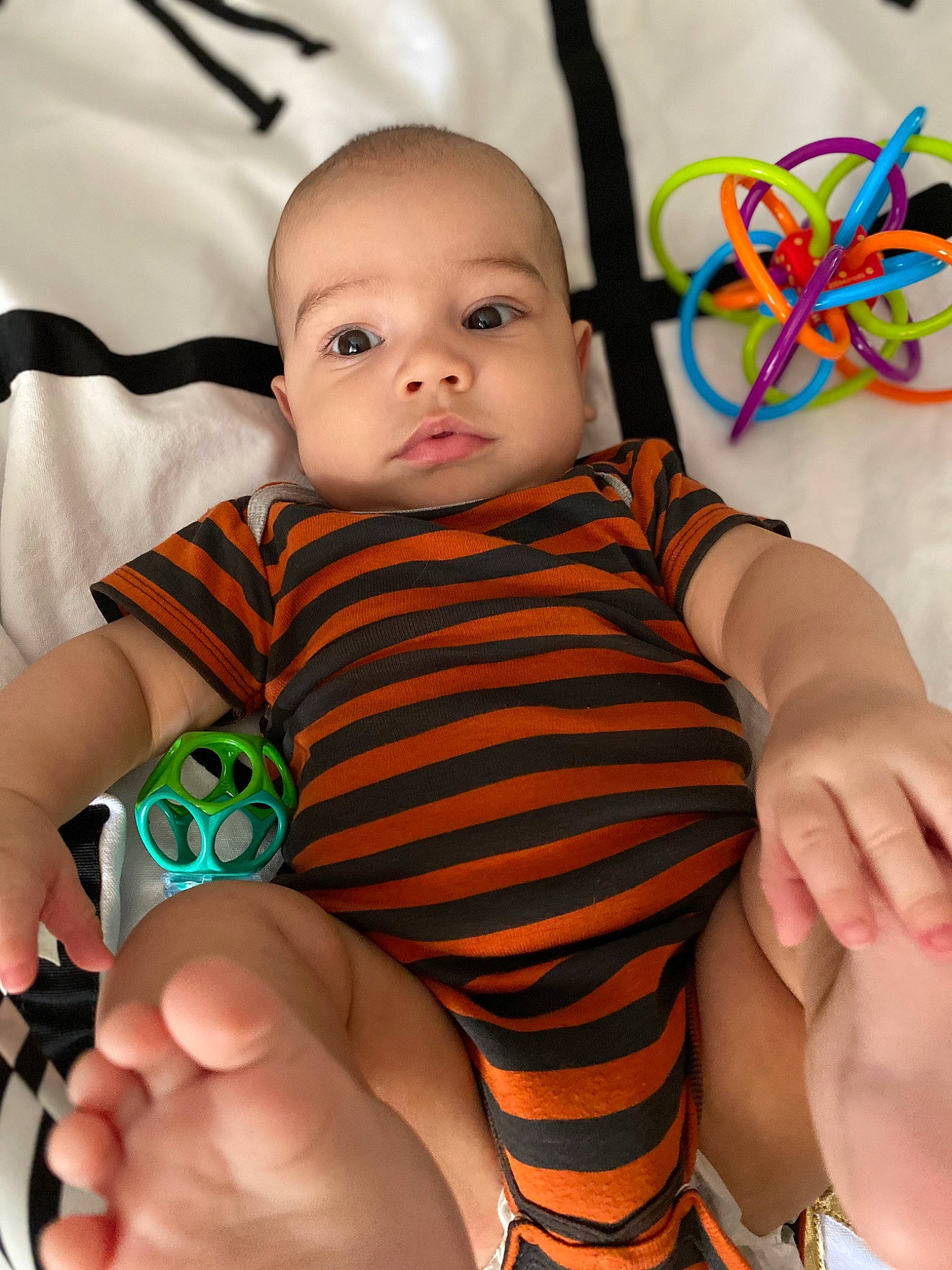 Lennon joined the competition — help win amazing prizes! baby, baby_toddler_clothing, cheek, eye, face, facial_expression, finger, gesture, hand, happy, head, human, iris, neck, person, product, skin, sleeve, thumb, toddler