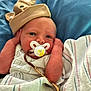 Cooper joined the competition — help win amazing prizes! newborn, baby, pacifier, hat, blanket, hospital, infant, cute, wrapped, face, hands, blue_background, clothing, sleepwear, resting, portrait, person, lying_down, soft, skin