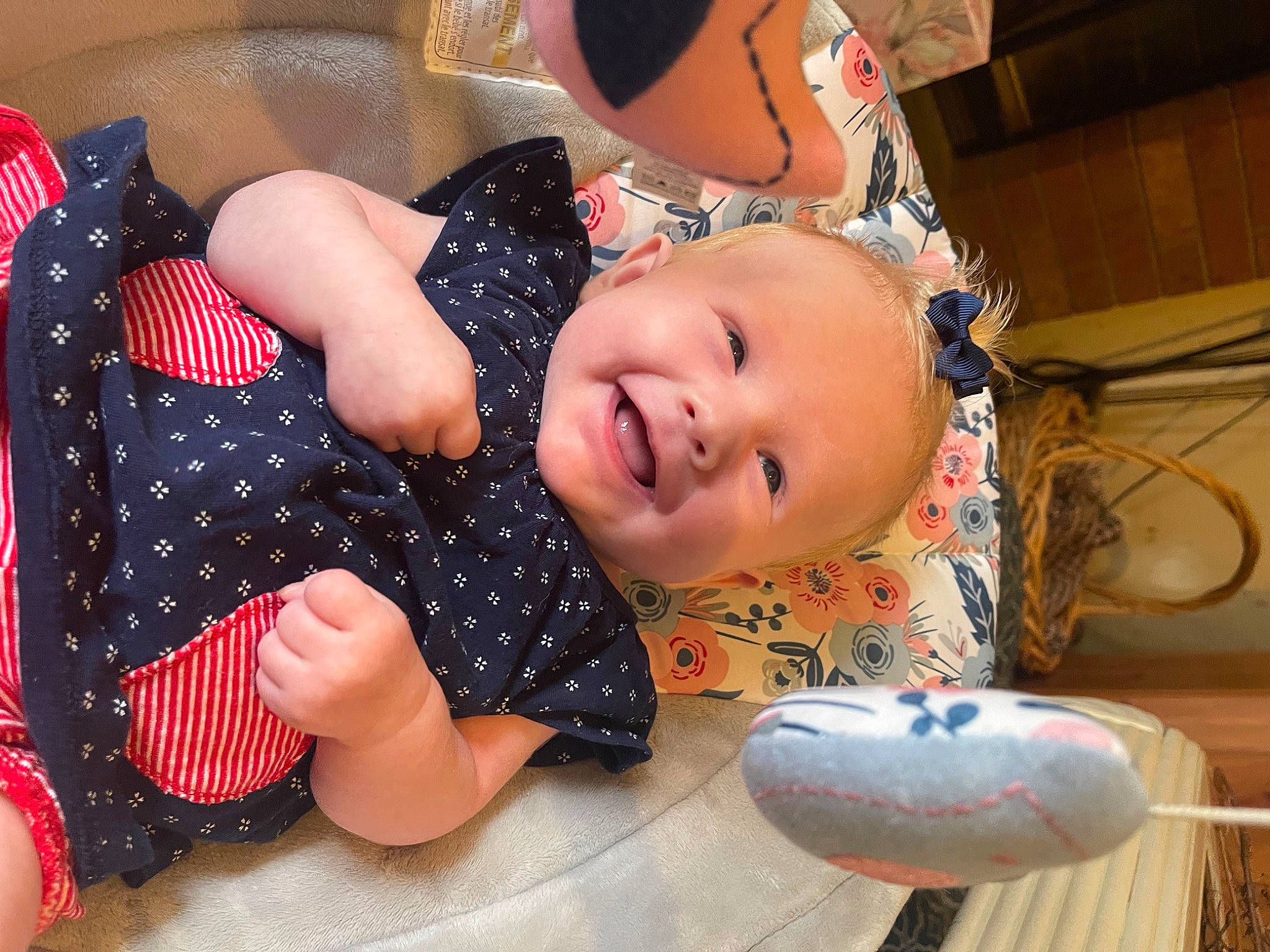 Journi is registered to the contest to win money with this photo: baby, baby_laughing, baby_products, baby_toddler_clothing, cheek, child, comfort, flooring, fun, happy, human_leg, joy, leisure, nail, pattern, person, plaid, play, smile, sock