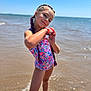 Lola participe au concours pour gagner de l'argent avec cette photo : child, girl, beach, ocean, water, swimsuit, braids, purple_hair, sunny, sky, sand, waves, posing, playful, smiling, summer, outdoor, vacation, water_splash, happy