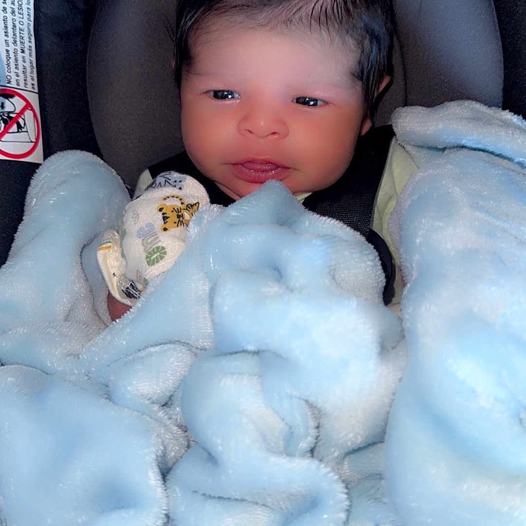 Zeke joined the competition — help win amazing prizes! newborn, baby, blanket, car_seat, infant, face, head, clothing, cute, cozy, heart, love, soft, warm, child, portrait, indoors, newborn_baby, wrapped, baby_girl_or_boy