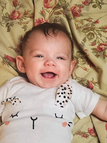 Brinleigh joined the competition — help win amazing prizes! baby, baby_toddler_clothing, cheek, chin, eye, eyebrow, face, facial_expression, happy, head, iris, joy, lip, nose, person, pink, skin, sleeve, smile, textile