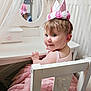 toddler, child, pink_crown, tutu_dress, white_chair, vanity_mirror, curtains, smile, indoor, furniture, face, person, cute, birthday_hat, playroom, pink, dress, hair, baby, happy