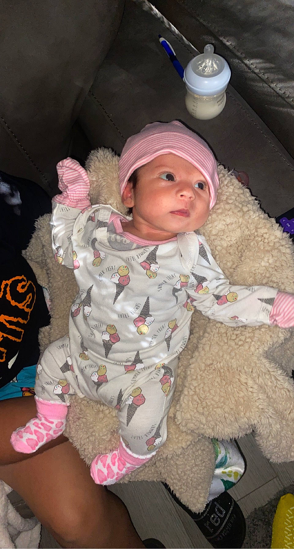 Angela joined the competition — help win amazing prizes! baby, baby_products, baby_toddler_clothing, cap, cheek, child, comfort, costume, flooring, foot, fun, fur, headwear, pattern, person, pink, sitting, skin, sleeve, smile