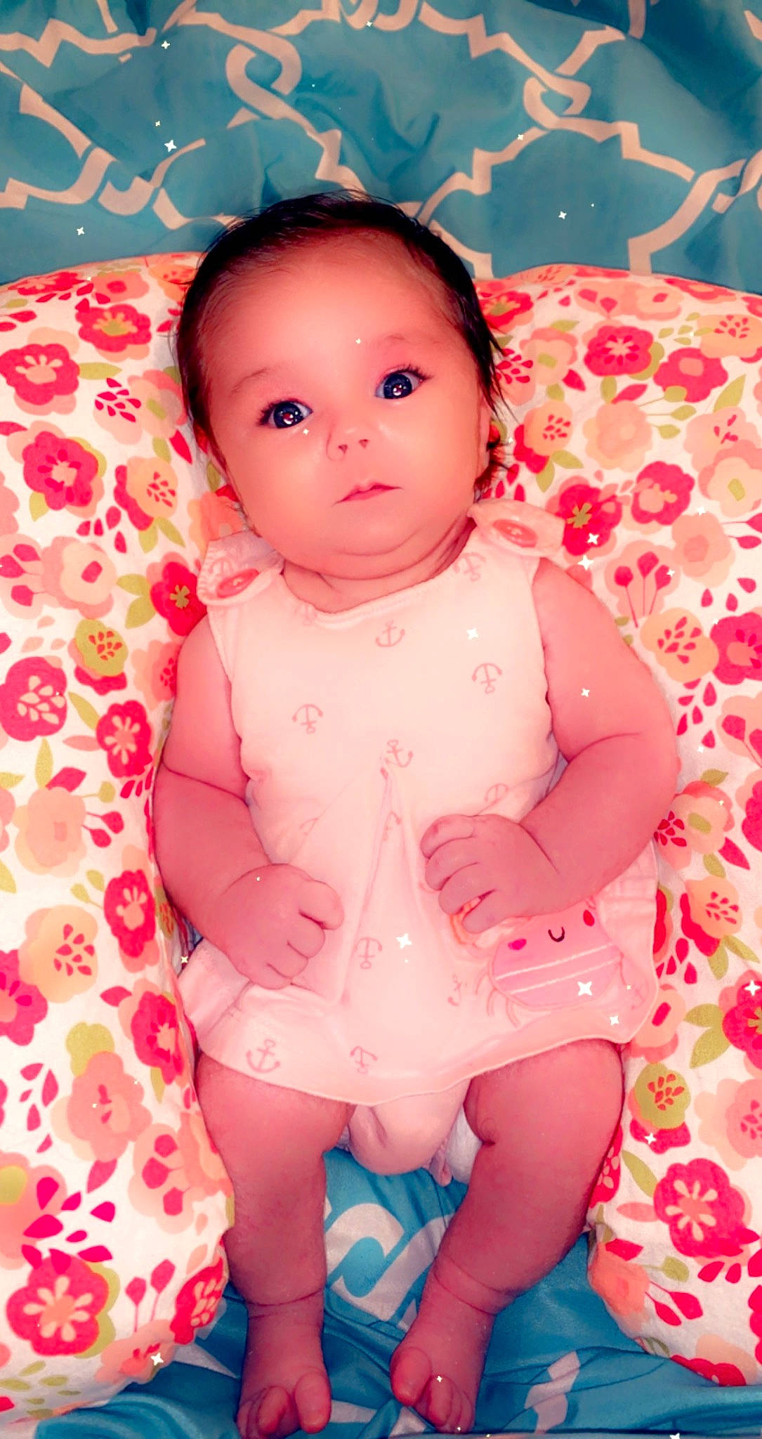 Addilyn is registered to the contest to win money with this photo: baby, baby_toddler_clothing, cheek, child, happy, linens, lip, magenta, pattern, peach, person, pink, room, sitting, skin, sleeve, textile, thigh, toddler