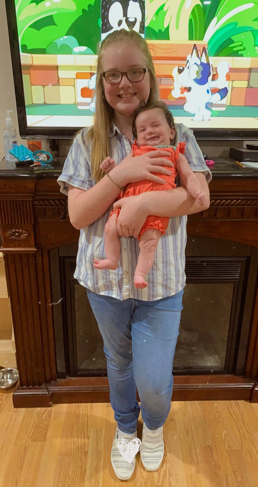 Reagan joined the competition — help win amazing prizes! baby, baby_toddler_clothing, finger, flooring, fun, gesture, glasses, happy, hardwood, joint, joy, knee, person, product, skin, smile, standing, t_shirt, thigh, thumb