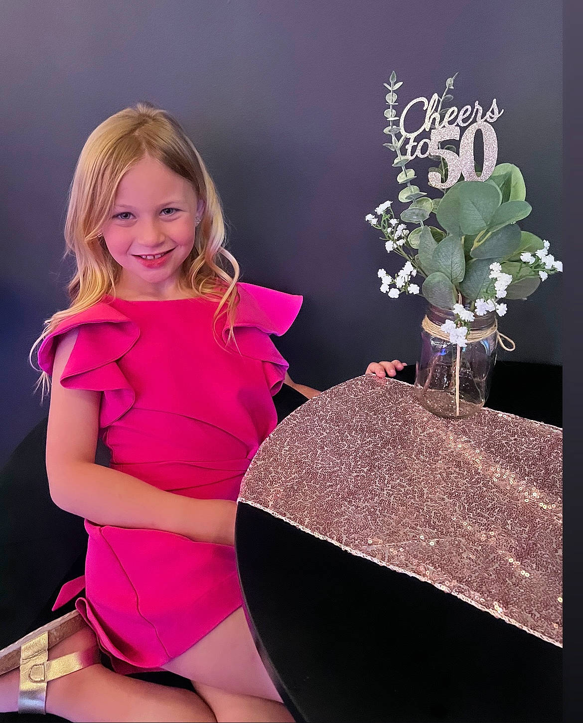 Kinley is registered to the contest to win money with this photo: abdomen, brown_hair, cocktail_dress, electric_blue, event, fashion_accessory, fashion_design, fashion_model, formal_wear, human_leg, joy, knee, leggings, magenta, person, plant, sitting, sleeve, smile, sportswear