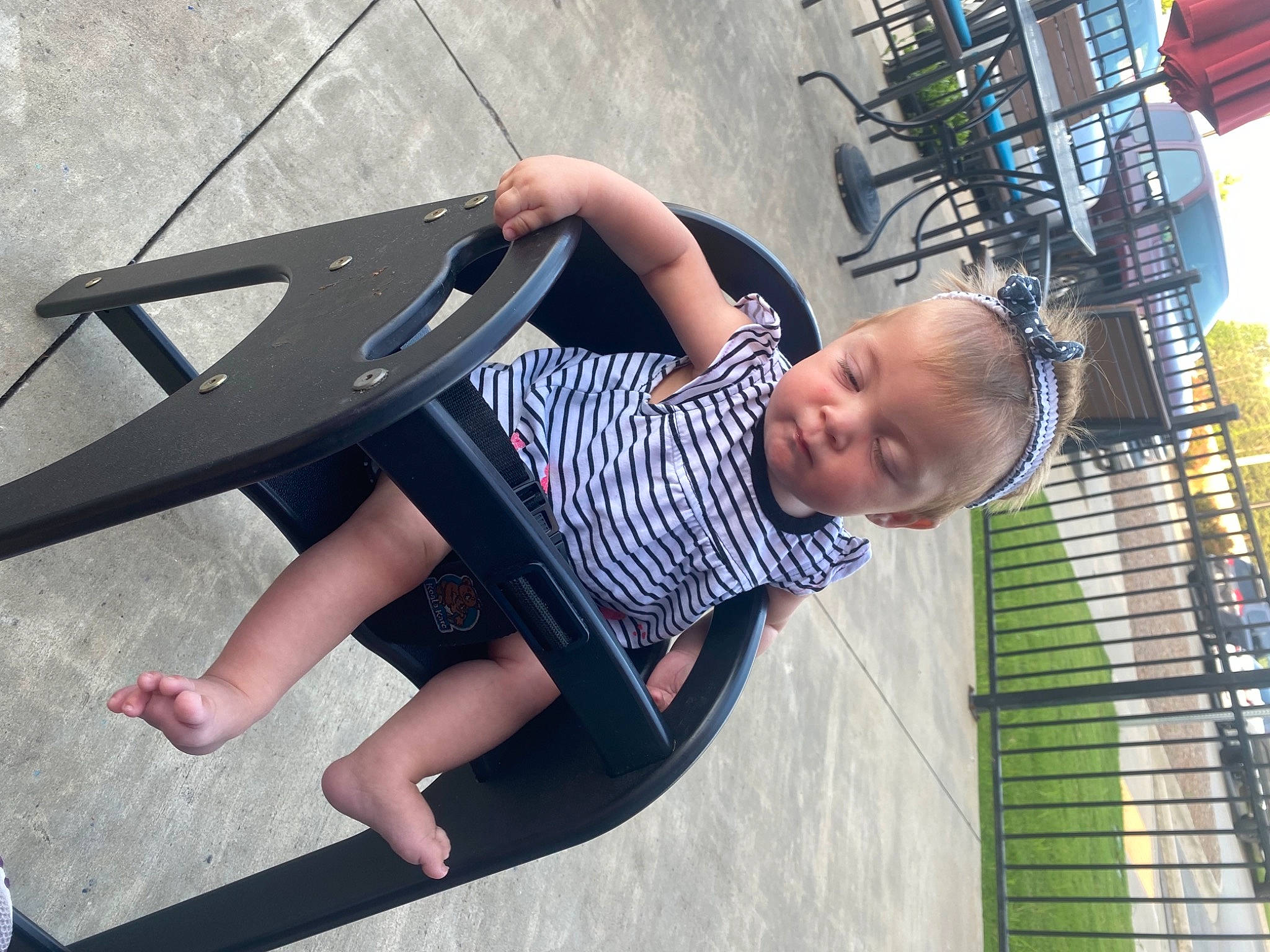 Kaezlynn joined the competition — help win amazing prizes! barefoot, child, city, flash_photography, foot, fun, happy, human_body, human_leg, leisure, organ, person, public_space, recreation, sandal, shorts, sitting, t_shirt, thigh, toddler