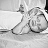 Daxton joined the competition — help win amazing prizes! baby, black_and_white, blanket, calm, child, closeup, cozy, face, hands, hat, indoors, infant, newborn, peaceful, portrait, quiet, resting, sleeping, soft_texture, wrapped