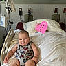 Luca joined the competition — help win amazing prizes! baby, hospital_bed, medical_equipment, onesie, smiling, child, indoor, person, bed, blanket, healthcare, monitor, wall, plug, hospital_room, head, skin, comfort, sitting, cute