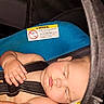 Luca is registered to the contest to win money with this photo: baby, car_seat, sleeping, child, infant, straps, blue, warning_label, seatbelt, peaceful, closeup, relaxed, indoor, transportation, person, cute, chubby, head, skin, comfort