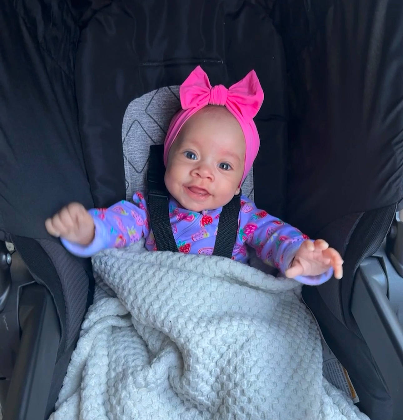 Azayla joined the competition — help win amazing prizes! baby, baby_toddler_clothing, cap, car_seat, cheek, child, comfort, costume_hat, fun, happy, headwear, human_body, magenta, person, pink, product, purple, sleeve, smile, textile