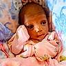 Hazel is registered to the contest to win money with this photo: baby, infant, blanket, pajamas, face, eyes, hands, sleepwear, cute, newborn, cozy, bed, soft, child, portrait, pink, floral, resting, small, indoors