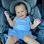 Elijah is registered to the contest to win money with this photo: toddler, child, car_seat, smiling, happy, white_tank_top, blue_shorts, seat_belt, gray_car_seat, baby, cute, indoors, sitting, playful, infant, young_child, portrait, car_interior, seat, person